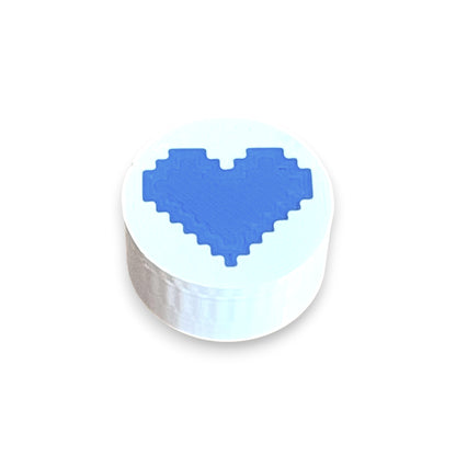 Guitar Pedal Footswitch Topper for 8.5mm / 10mm / 11mm Foot Switch. 3D printed Heart Design on a White Topper with a Blue heart by Cold Earth Industries, shown on a white background.