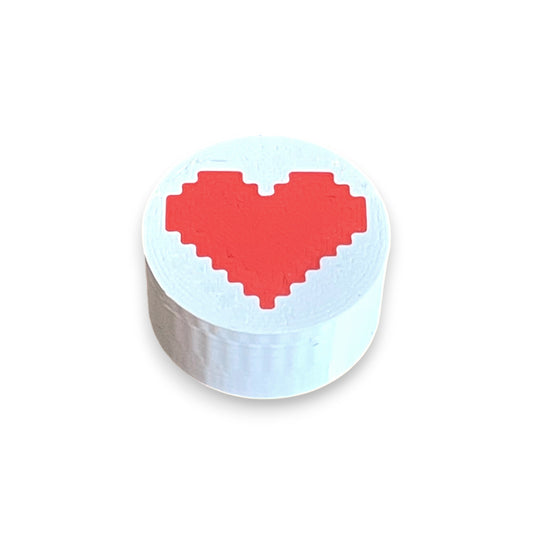 Guitar Pedal Footswitch Topper for 8.5mm / 10mm / 11mm Foot Switch. 3D printed Heart Design on a White Topper with a Red heart by Cold Earth Industries, shown on a white background.