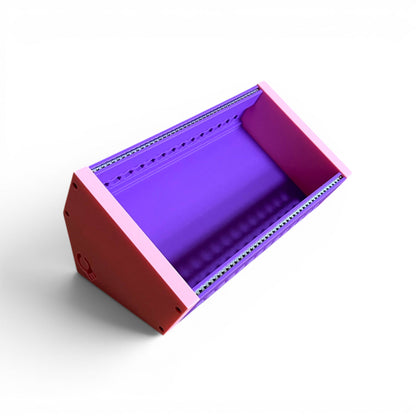 3D printed 42HP 3U Eurorack modular synthesizer case by Cold Earth Industries,  with purple body and pink side panels on a white background – custom desktop skiff enclosure.