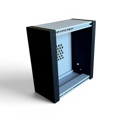 3D printed 20HP 3U Eurorack modular synthesizer case by Cold Earth Industries, shown, front angle view stood up, with grey body and black side panels on a white background – custom desktop skiff enclosure.