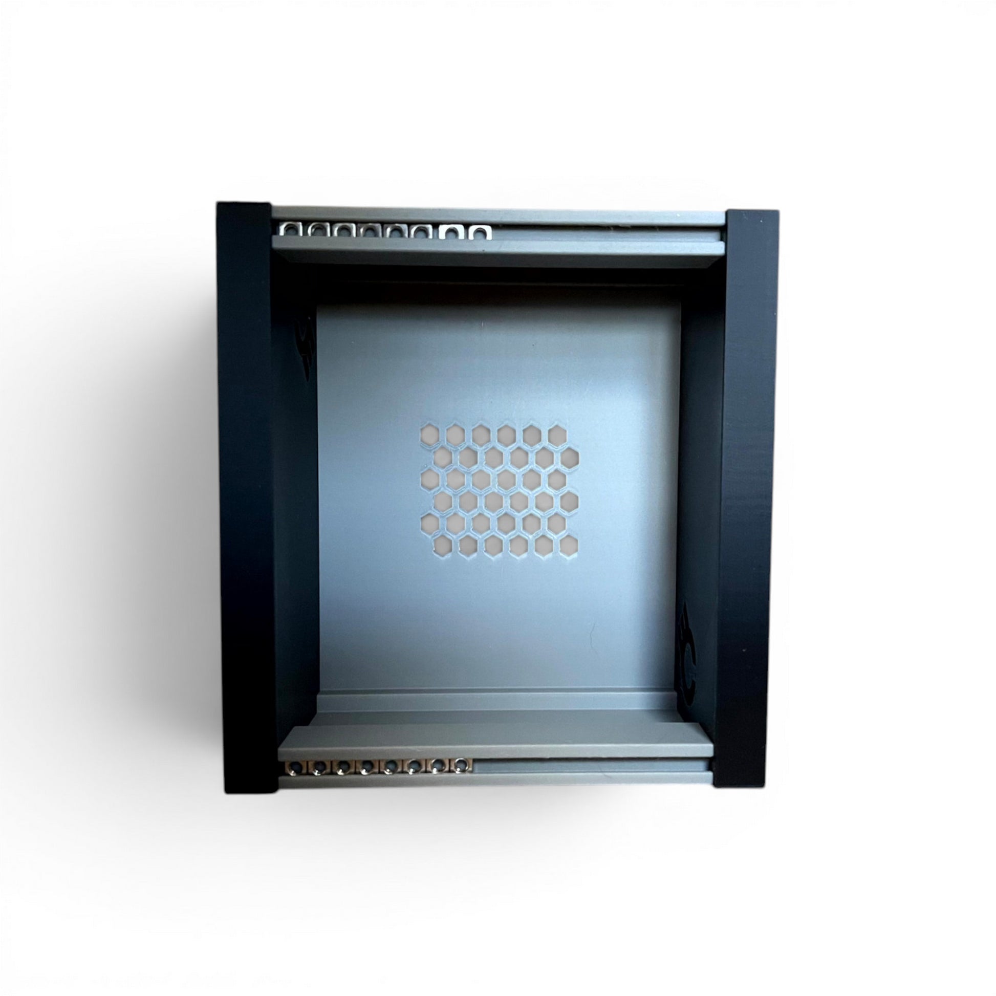 3D printed 20HP 3U Eurorack modular synthesizer case by Cold Earth Industries, shown, front view stood up, with grey body and black side panels on a white background – custom desktop skiff enclosure.