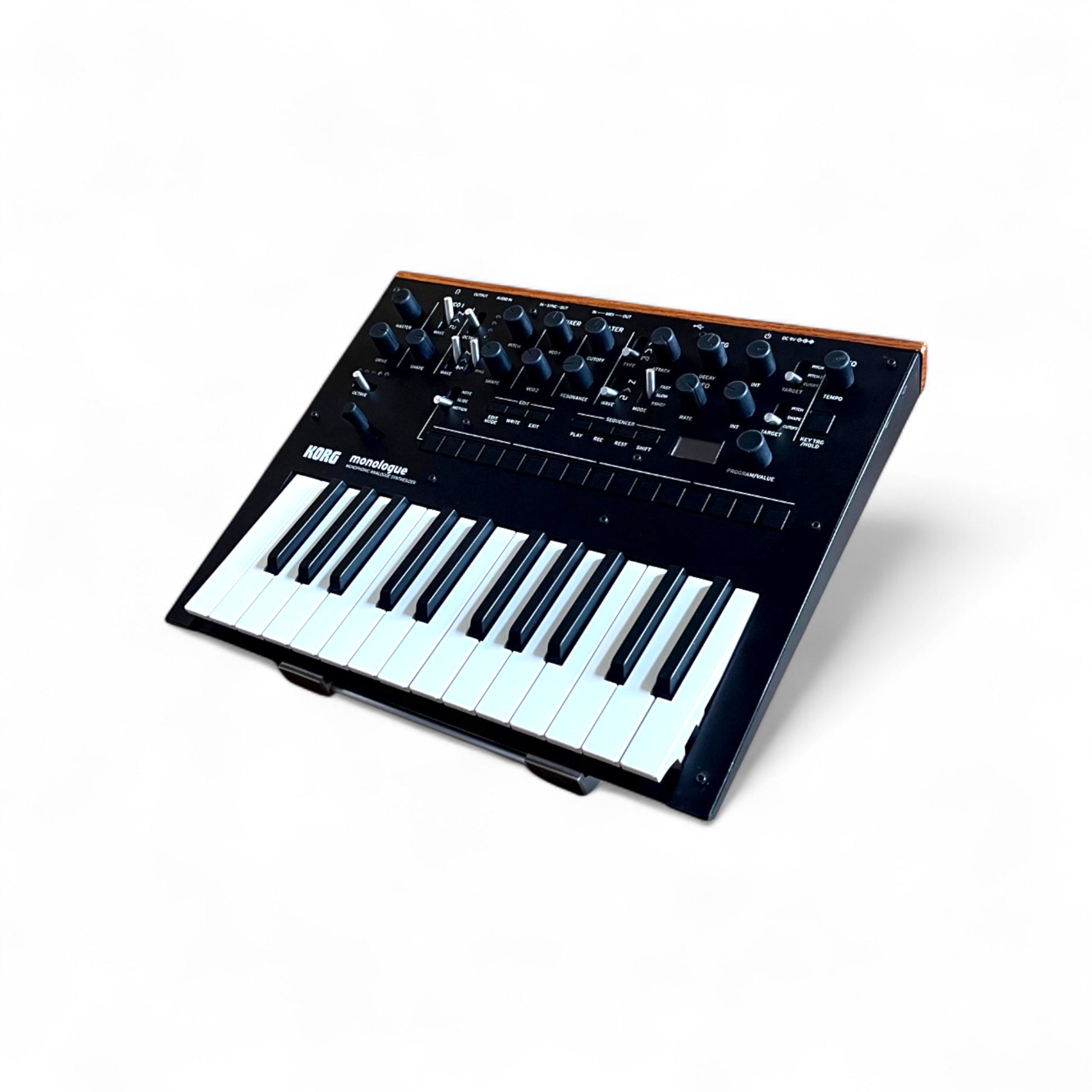 3D printed Korg Monologue Synth 30 degree stand by Cold Earth Industries, shown in white on a white background holding a Korg Monologue