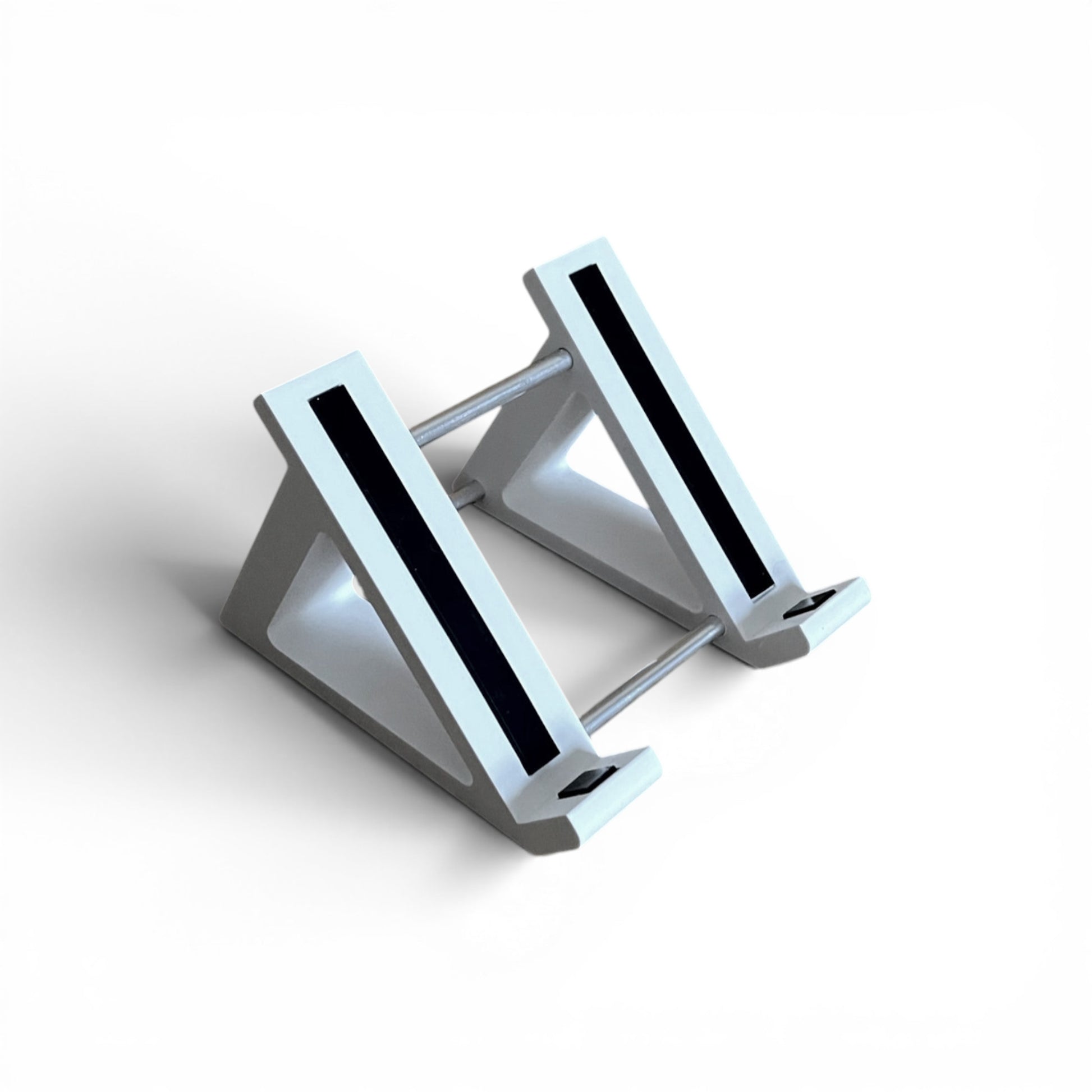 A 3D printed 45 degree white guitar pedal stand with rubber strips and recessed rubber feet, designed for the Line 6 HX Stomp Amp and Effects Processor.
