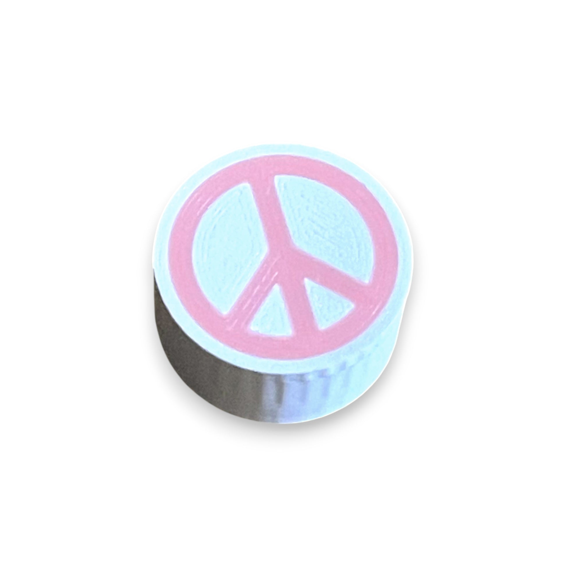 Guitar Pedal Footswitch Topper for 8.5mm / 10mm / 11mm Foot Switch. 3D printed Pink Peace Design by Cold Earth Industries, shown on a guitar pedal, on a white background.