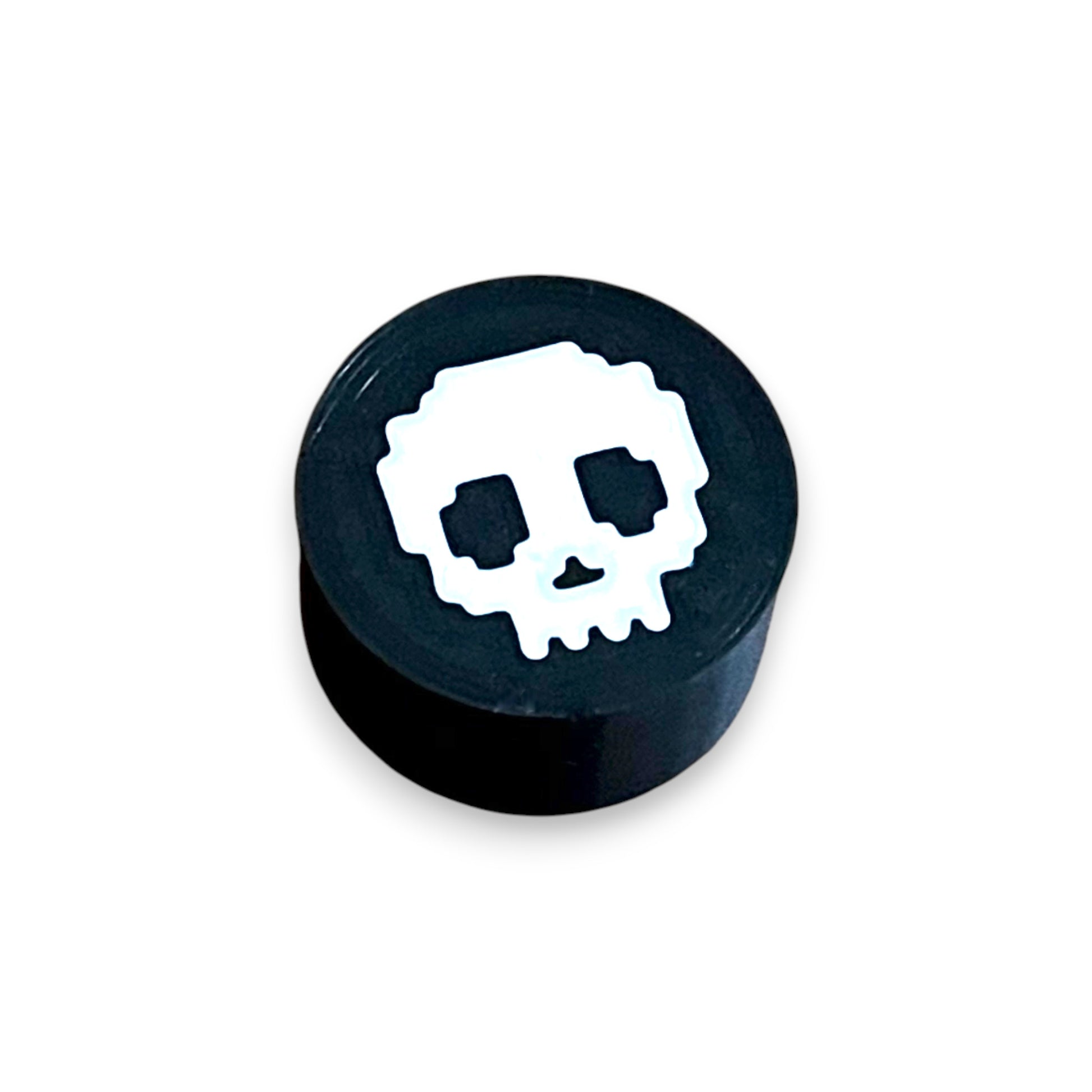 Guitar Pedal Footswitch Topper for 8.5mm / 10mm / 11mm Foot Switch. 3D printed White Skull Design by Cold Earth Industries, shown on a guitar pedal, on a white background.