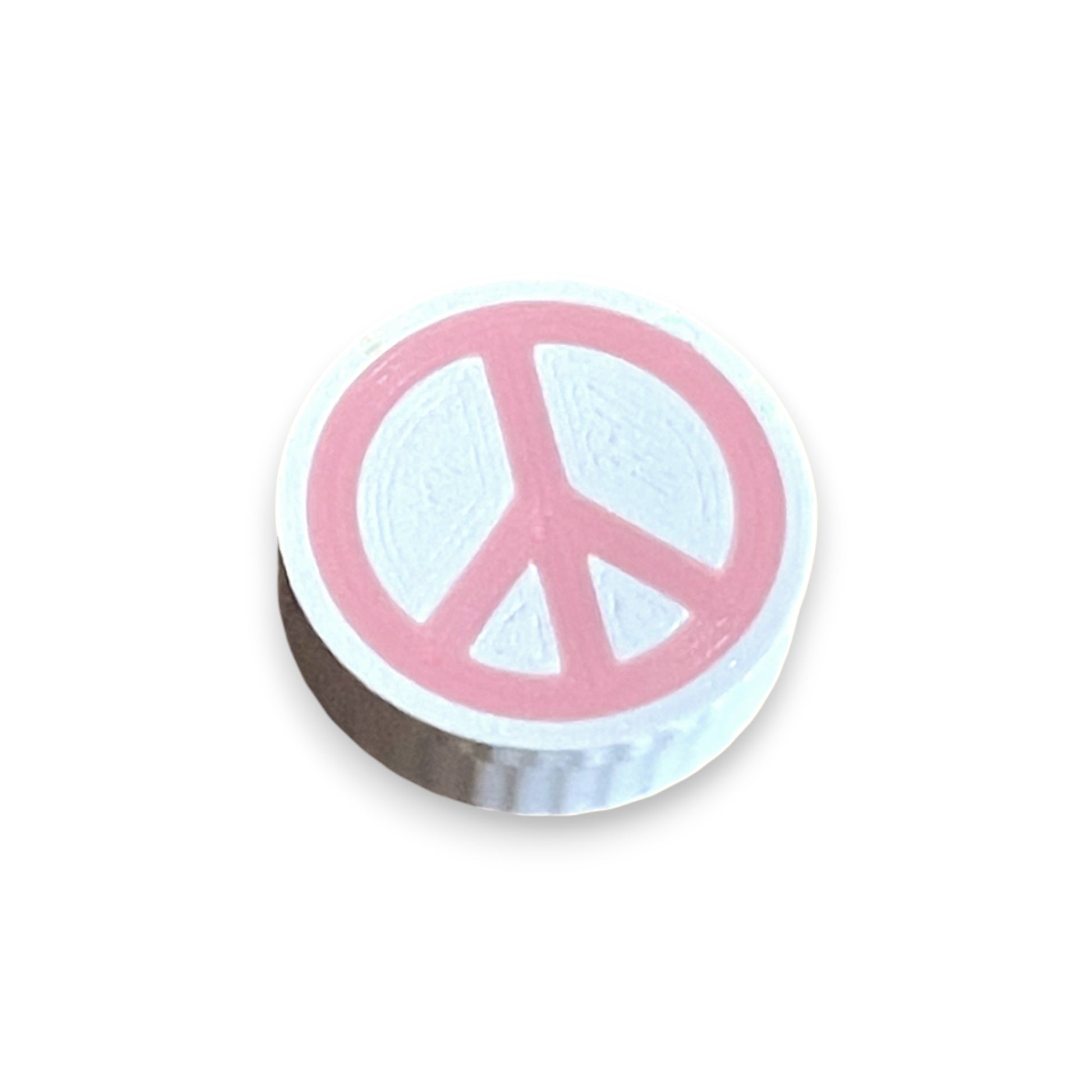 Low Profile Guitar Pedal Footswitch Topper for 8.5mm / 10mm / 11mm Foot Switch. 3D printed Pink Peace Design by Cold Earth Industries, shown on a guitar pedal, on a white background.