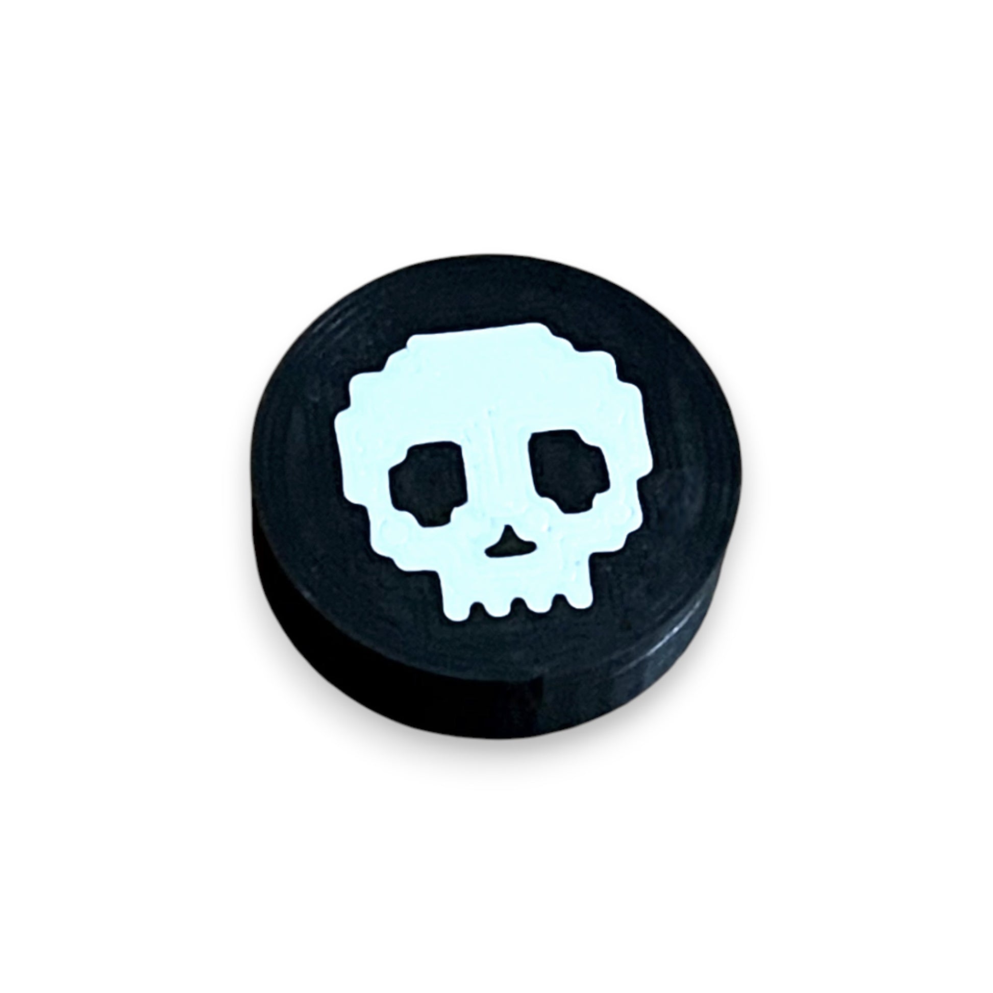 Low Profile Guitar Pedal Footswitch Topper for 8.5mm / 10mm / 11mm Foot Switch. 3D printed White Skull Design by Cold Earth Industries, shown on a guitar pedal, on a white background.