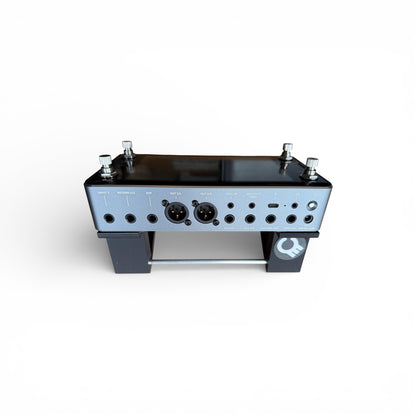 3D printed Neural DSP Quad Cortex Mini Guitar Pedal 30 Degree stand by Cold Earth Industries, shown back view with Quad Cortex Mini, in black on a white background – custom desktop stands.
