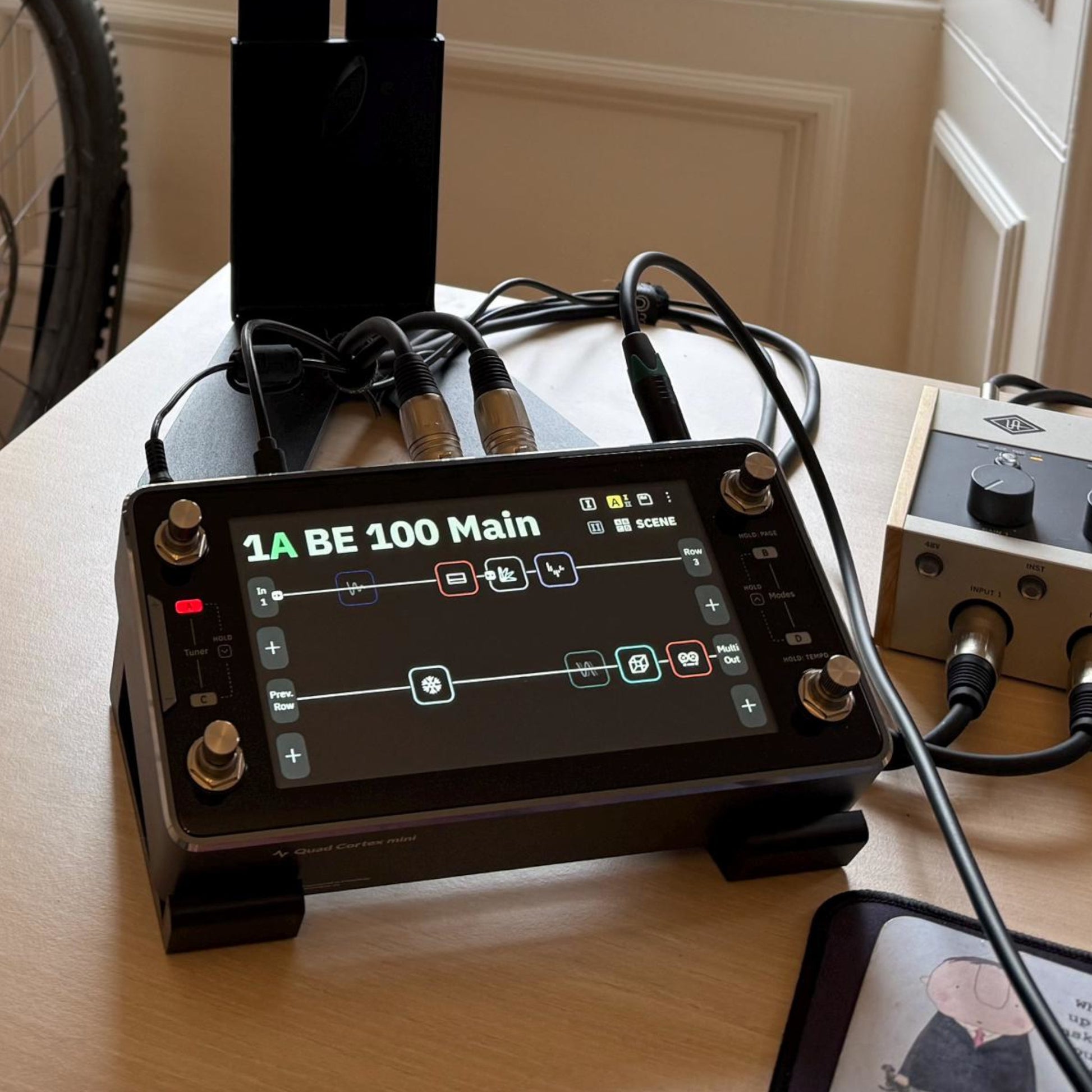 3D printed Neural DSP Quad Cortex Mini Guitar Pedal 30 Degree stand by Cold Earth Industries, shown in black in a music studio, with the Quad Cortex Mini – custom desktop stands.