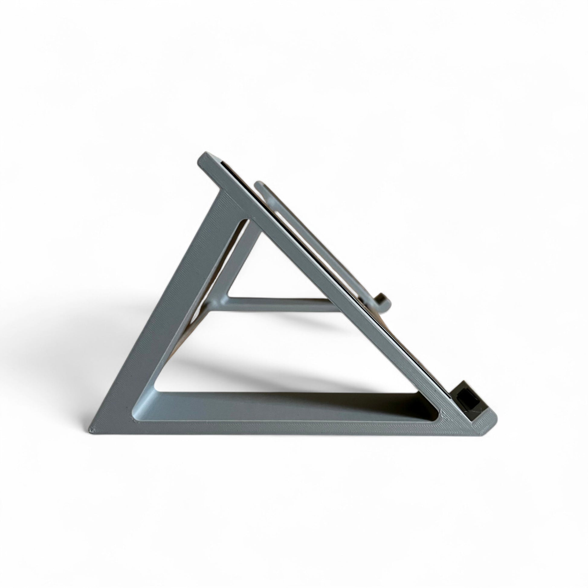 3D printed Korg Minilogue XD Module Synth 45 degree stand by Cold Earth Industries, shown side view in grey on a white background