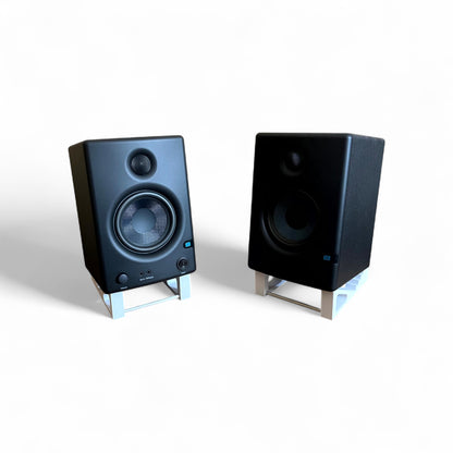 A pair of 3D printed Presonus Eris E4.5 Studio Speaker / Monitor 0 - 24 degree stands holding a pair of Presonus Eris 4.5 speakers, by Cold Earth Industries. Shown in white on a white background