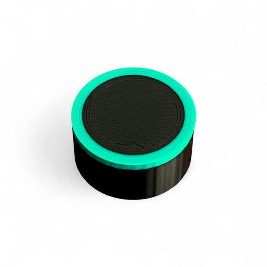 Guitar Pedal Footswitch Topper for 10MM Foot Switch. 3D printed Black Base and Green Ring Design by Cold Earth Industries, shown on a white background.