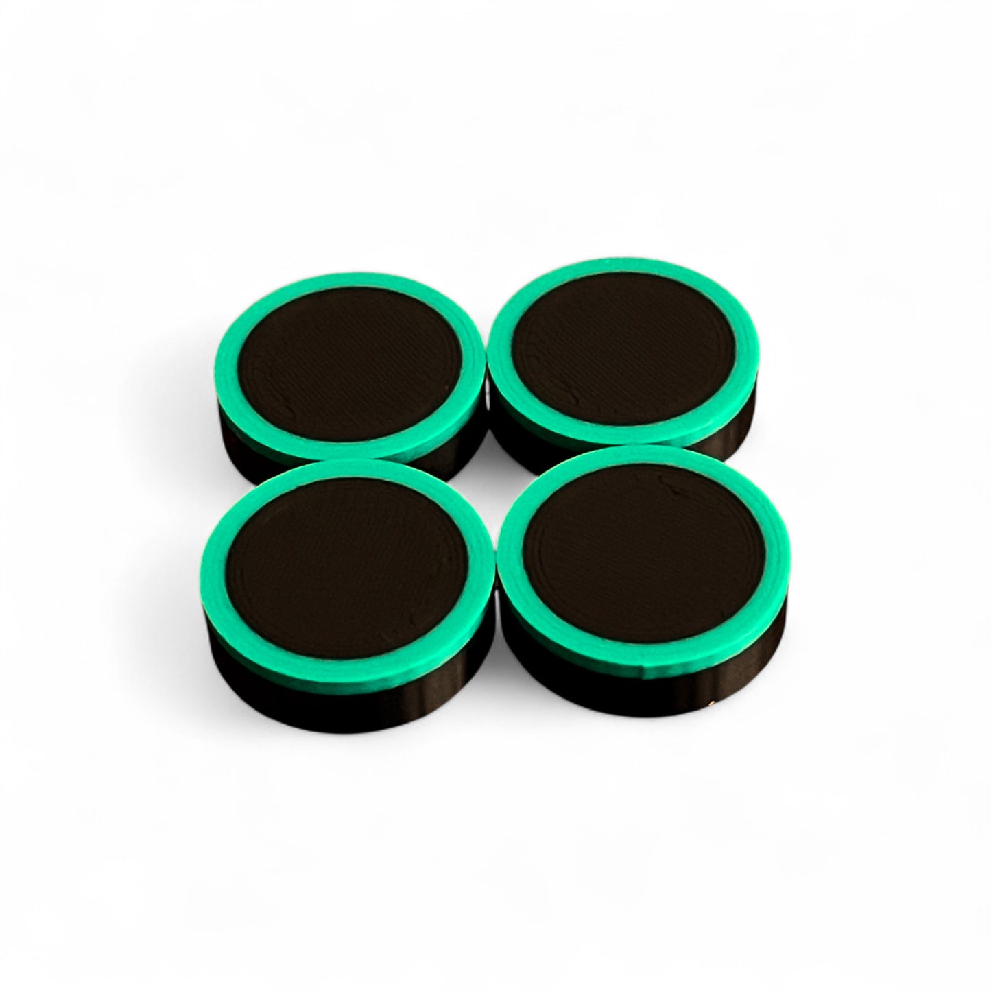 Set of 4 Guitar Pedal Footswitch Topper Low Profile for 11MM Foot Switch. 3D printed Black Base and Green Ring Design by Cold Earth Industries, shown on a white background.