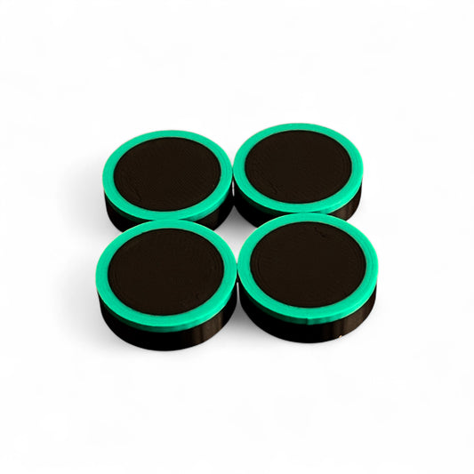 Set of 4 Guitar Pedal Footswitch Topper Low Profile for 11MM Foot Switch. 3D printed Black Base and Green Ring Design by Cold Earth Industries, shown on a white background.