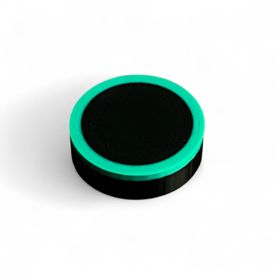 Guitar Pedal Footswitch Topper Low Profile for 11MM Foot Switch. 3D printed Black Base and Green Ring Design by Cold Earth Industries, shown on a white background.