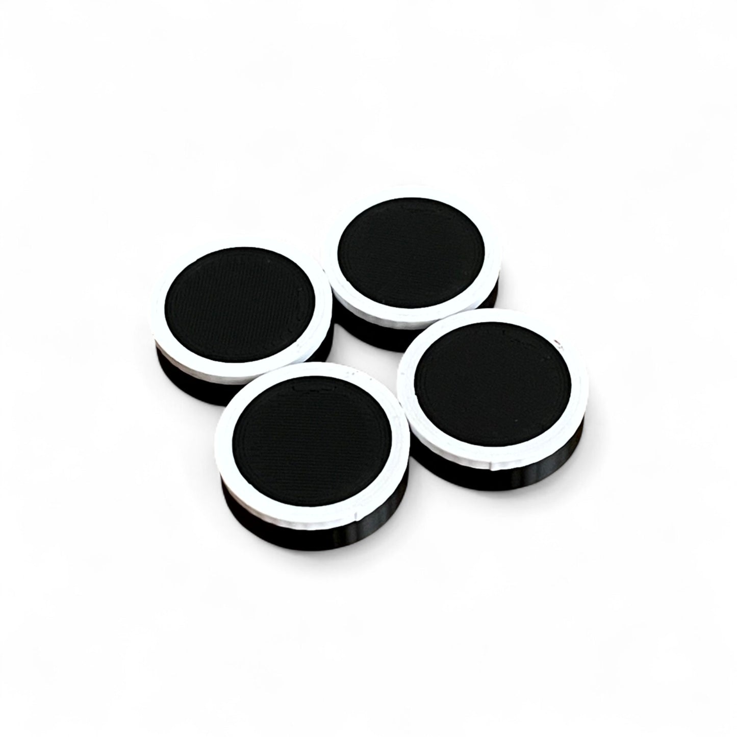Set of 4 Guitar Pedal Footswitch Topper Low Profile for 11MM Foot Switch. 3D printed Black Base and White Ring Design by Cold Earth Industries, shown on a white background.