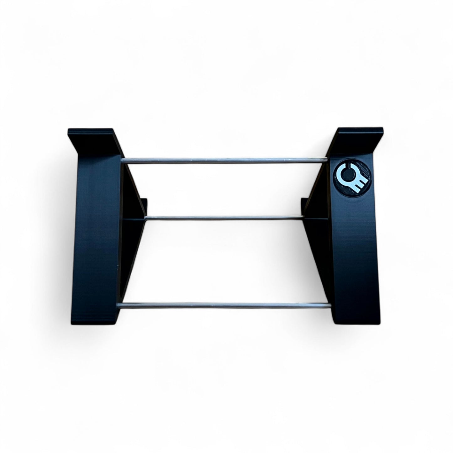 Back view of a black desktop stand from Cold Earth Industries designed for the Roland SH-4d Digital Desktop Synthesizer, featuring a robust PLA+ & aluminum structure at a 45 degree angle.