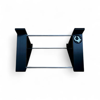 Back view of a black desktop stand from Cold Earth Industries designed for the Roland SH-4d Digital Desktop Synthesizer, featuring a robust PLA+ & aluminum structure at a 45 degree angle.