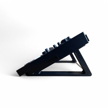 3D printed Roland TR-8S Rhythm Performer Drum Machine 30 degree stand by Cold Earth Industries, shown side view in black on a white background, holding a Roland TR-8S