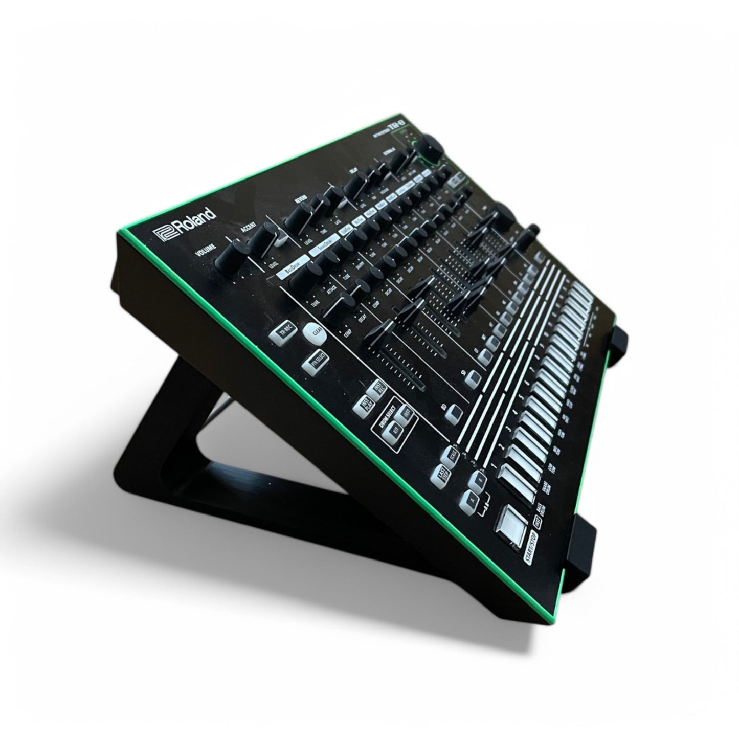 3D printed Roland TR-8 Rhythm Performer Drum Machine 30 degree stand by Cold Earth Industries, shown in black on a white background holding a Roland TR-8 Rhythm Performer