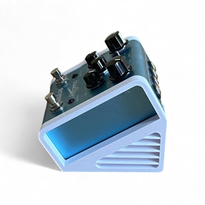 3D printed Strymon Strymon Pedal Stand Guitar Pedal 30 Degree stand by Cold Earth Industries, shown side view in white on a white background with Strymon blueSky guitar pedal