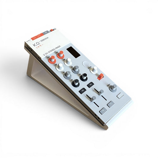 3D printed Teenage Engineering KO-Sidekick Mixer + Audio Interface  Mixer 20 Degree stand by Cold Earth Industries, shown with Sidekick Mixer, in white, on a white background – custom desktop stands.